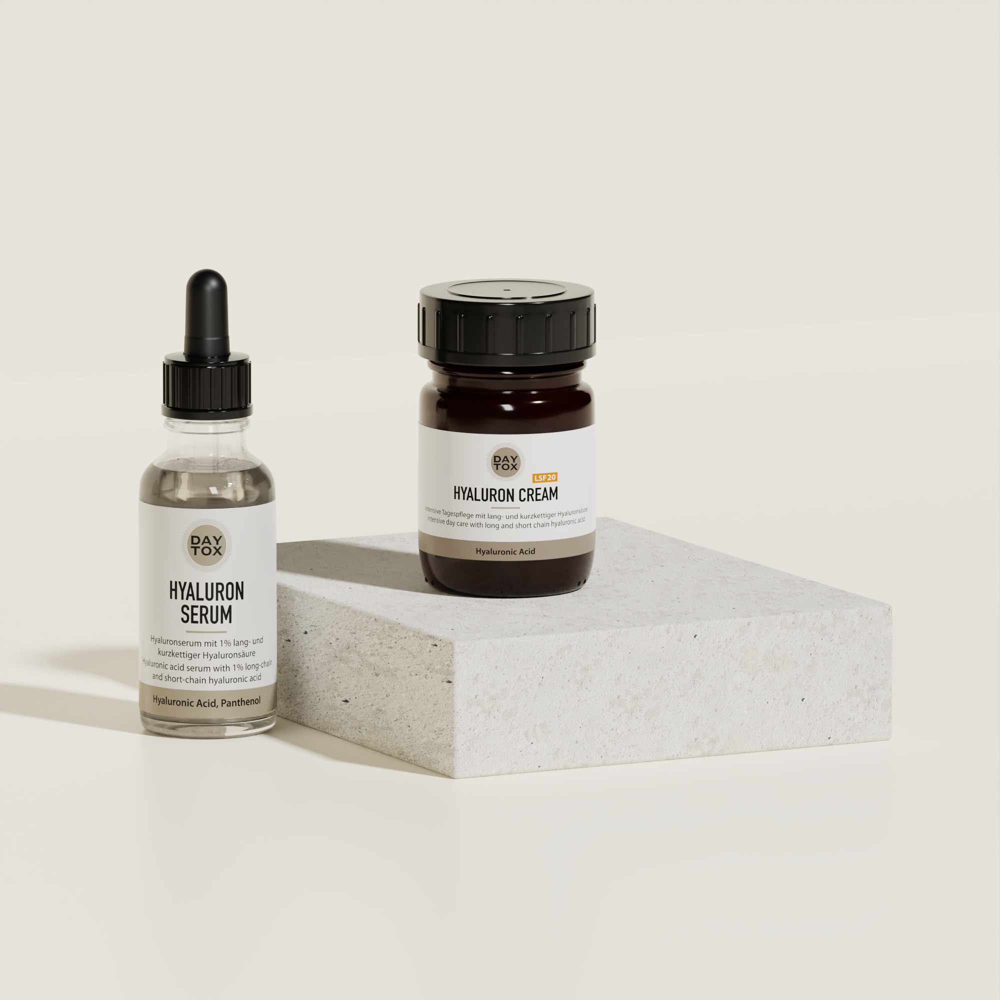 Hyaluron Serum und Hyaluron Cream auf Podest aus Marmor